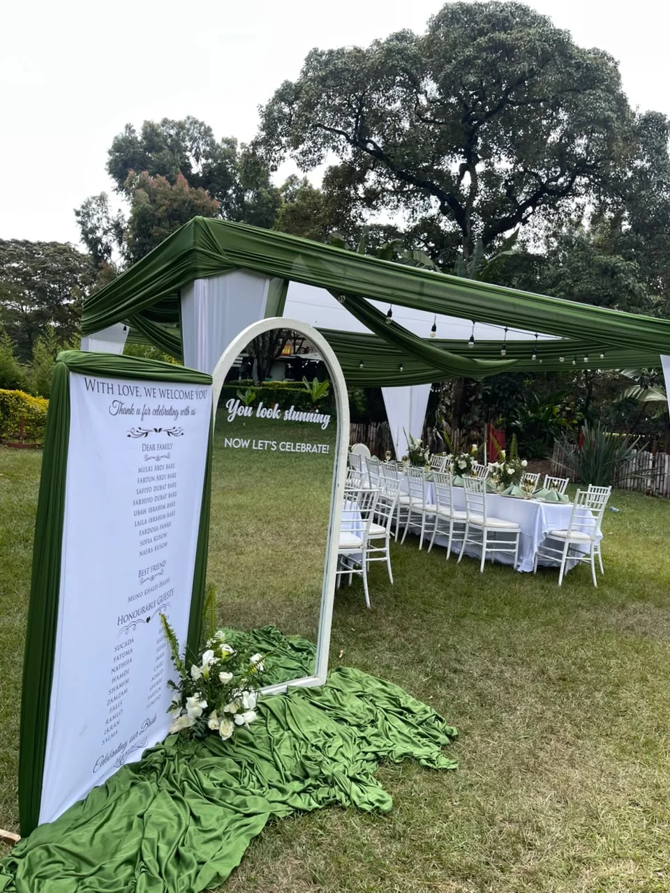 Beautiful garden event space with green lawns and mature trees